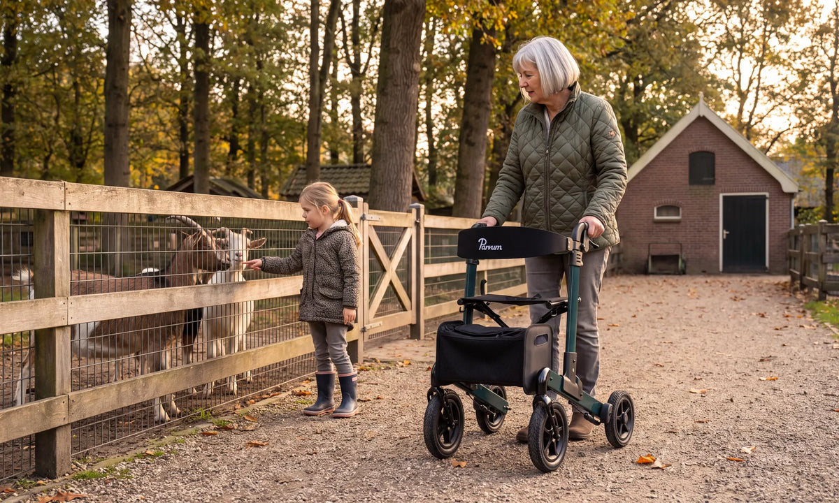 Parvum Luxo Air in petrol green at a petting farm; a woman watches a girl with the goats.