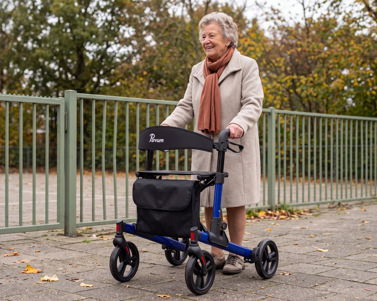 Parvum Riva in blue by a school gate; a woman with gray curls laughs, her hands on the handles.