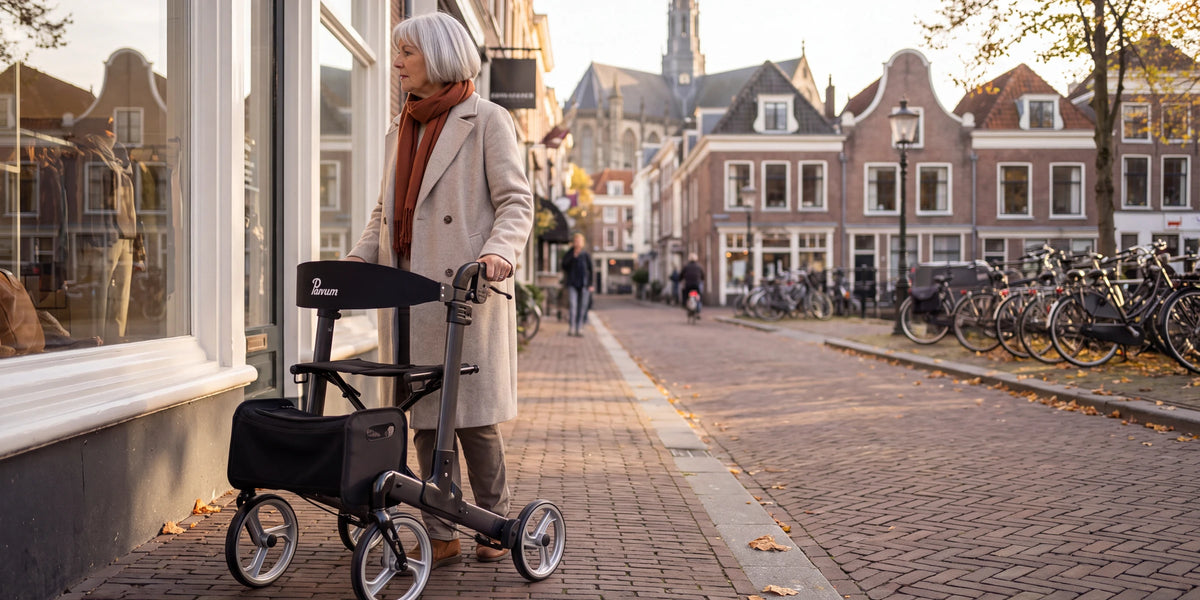 Parvum Luxo in anthracite on an old shopping street; a woman stops and looks at a shop window.